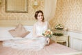 Pretty young Bride. Boudoir morning of the bride. Royalty Free Stock Photo