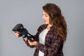 Pretty young brunette girl testing virtual reality glasses Royalty Free Stock Photo