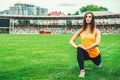 Cute young brunette sporty girl workout outdoor