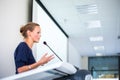 Pretty, young business woman giving a presentation Royalty Free Stock Photo