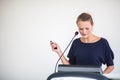 Pretty, young business woman giving a presentation in a conference/meeting setting Royalty Free Stock Photo