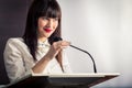 Pretty, young business woman giving a presentation in a conference Royalty Free Stock Photo