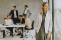 Young business woman standing in the office in front of her team Royalty Free Stock Photo