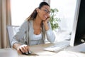 Pretty young business woman working with her computer in the office Royalty Free Stock Photo