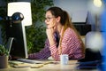 Pretty young business woman working with her laptop in the office. Royalty Free Stock Photo