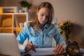 Pretty young businesswomen working at her office, using computer and plans works tasks. Busy at work. Online studying. Freelance Royalty Free Stock Photo