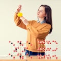 Pretty young caucasian student working in the chemistry lab. College student holding chemistry glassware. Royalty Free Stock Photo