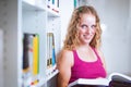 Pretty, young college student in a library