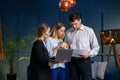 Pretty young couple on the meeting with realtor in the office. Royalty Free Stock Photo