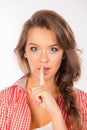 Pretty young cute woman making silence sign Royalty Free Stock Photo