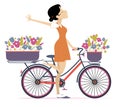 Pretty young cycling woman with bouquets of flowers in the baskets
