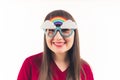 Pretty young dark-haired woman in extraordinary glasses with rainbow white background isolated copy space medium closeup Royalty Free Stock Photo