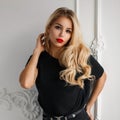 Pretty young elegant woman in a trendy black T-shirt
