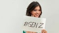 Pretty young excited woman holding  GENZ text in board Royalty Free Stock Photo