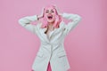 Pretty young female attractive look white blazer pink wig color background unaltered Royalty Free Stock Photo