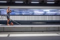 Pretty, young female commuter waiting for her daily train Royalty Free Stock Photo