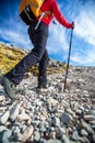 Pretty, young female hiker going uphill