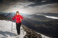 Pretty, young female hiker going uphill