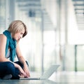 Pretty young female student on college/university campus Royalty Free Stock Photo