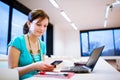 Pretty young female student with laptop Royalty Free Stock Photo