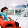 Pretty young female student with laptop Royalty Free Stock Photo
