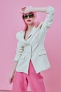 Pretty young female in White blazer pink hair Glamor Cosmetics color background unaltered Royalty Free Stock Photo