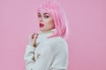 Pretty young female in White blazer pink hair Glamor Cosmetics color background unaltered Royalty Free Stock Photo