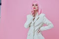 Pretty young female in White blazer pink hair Glamor Cosmetics color background unaltered Royalty Free Stock Photo