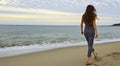 young girl on the beach, pretty girl walking on the beach, young woman running on the beach, backside view