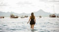 young girl on the beach, pretty girl walking on the beach, young woman running on the beach, backside view