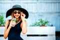 Pretty young girl drink cold coctail outdoor in beach cafe Royalty Free Stock Photo