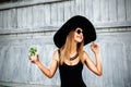 Pretty young girl drink cold coctail outdoor in beach cafe Royalty Free Stock Photo