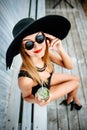 Pretty young girl drink cold coctail outdoor in beach cafe Royalty Free Stock Photo