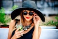 Pretty young girl drink cold coctail outdoor in beach cafe Royalty Free Stock Photo