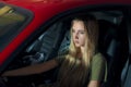 Pretty young girl driving a red sports car Royalty Free Stock Photo