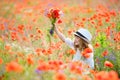 pretty young girl with flowers in hand and beautiful nature around Royalty Free Stock Photo