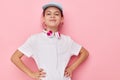 pretty young girl headphones in a white t-shirt and a cap Lifestyle unaltered Royalty Free Stock Photo