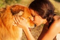 Pretty young girl kisses her cute dog Royalty Free Stock Photo