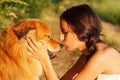 Pretty young girl kisses her cute dog Royalty Free Stock Photo