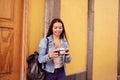 Pretty young girl looking at her camera smiling Royalty Free Stock Photo