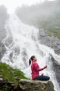 Pretty young girl meditating in nature. Royalty Free Stock Photo