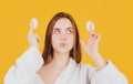 Pretty young girl with daily morning skincare procedures, cleansing face skin with natural lotion tonic using cotton Royalty Free Stock Photo