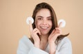 Pretty young girl with daily morning skincare procedures, cleansing face skin with natural lotion tonic using cotton Royalty Free Stock Photo