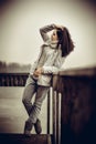 Pretty young girl outdoor on the old bridge Royalty Free Stock Photo