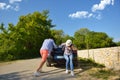 Pretty young girl pushing a convertible car Royalty Free Stock Photo