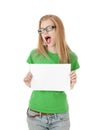 Pretty young girl showing empty blank paper sign for text. Royalty Free Stock Photo