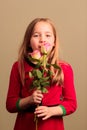 Pretty young girl smelling flowers Royalty Free Stock Photo