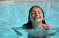 Pretty young girl in a swimming pool Royalty Free Stock Photo