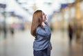 Pretty young happy business woman neck pain over blur background Royalty Free Stock Photo