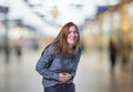 Pretty young happy business woman stomach pain over blur background Royalty Free Stock Photo